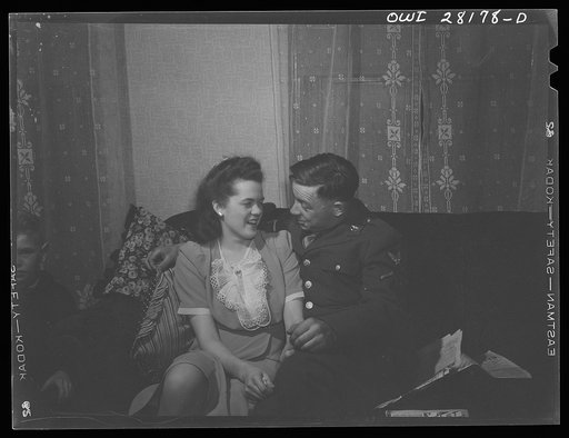 Niagara Falls, New York. One of the war workers living at Mrs. Hannegan's boardinghouse entertaining a friend