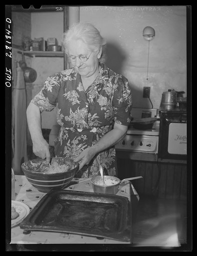 Niagara Falls, New York. Mrs. Hannegan making cookies. She runs a boardinghouse for girl war workers