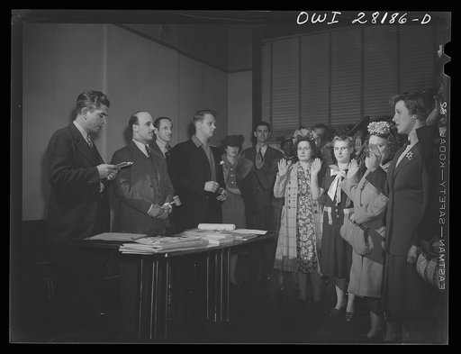 Buffalo, New York. Recently employed women being sworn into the rubber workers union at a Sunday meeting. Most of them have never worked before and know little about trade unionism