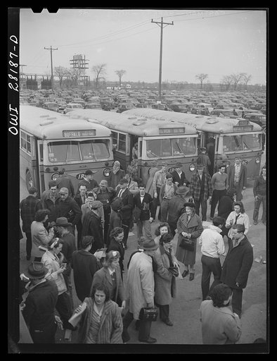 Niagara Falls, New York. The first shift of workers leaving the plant while the swing shift workers arrive at 4:15 p.m. at the Bell Aircraft plant