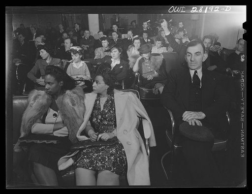 Buffalo, New York. A Sunday afternoon meeting of the rubber workers union. Despite the fact that the industry has only recently employed women, many of them are attending the meeting