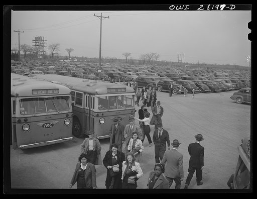 Niagara Falls, New York. Workers arriving on busses and in cars for the 4:30 p.m. shift at the Bell Aircraft