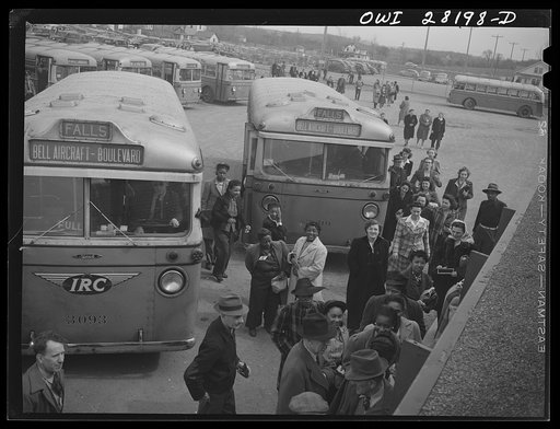 Untitled photo, possibly related to: Niagara Falls, New York. Workers arriving on busses and in cars for the 4:30 p.m. shift at the Bell Aircraft