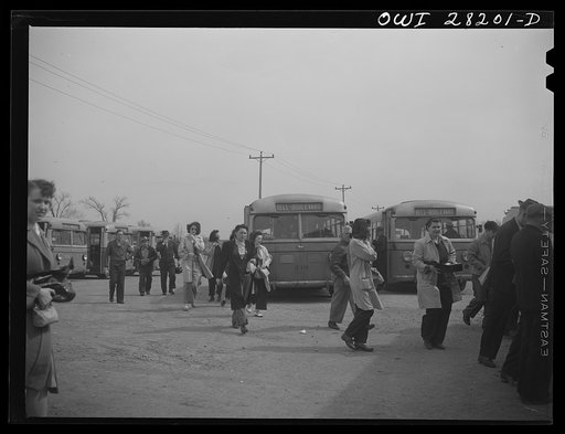 Untitled photo, possibly related to: Niagara Falls, New York. Workers arriving on busses and in cars for the 4:30 p.m. shift at the Bell Aircraft