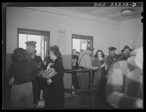 Niagara Falls, New York. All workers must show their badges and insides of their lunch boxes and packages to the guards at the gate when they enter and leave the Bell Aircraft plant
