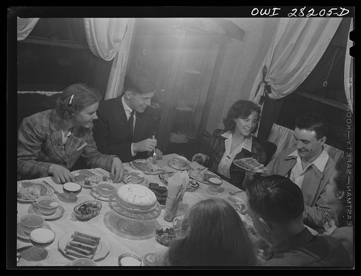 Untitled photo, possibly related to: Niagara Falls, New York. War workers who live at Mrs. Hannegan's boardinghouse having supper at 5:30