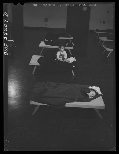 Buffalo, New York. Lakeview nursery school for children of working mothers, operated by the Board of Education at a tuition fee of three dollars weekly. Taking naps. One child cannot sleep
