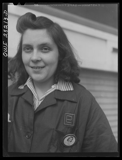 Untitled photo, possibly related to: Buffalo, New York. Mrs. Grimm, a twenty-six year old widow with six children who is a crane operator at Pratt and Letchworth (note the PL on her uniform), makers of castings used for ships, tanks, etc.