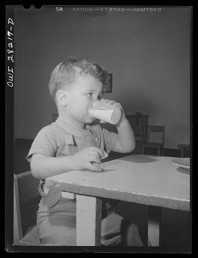 Buffalo, New York. Lakeview nursery school for children of working mothers, operated by the Board of Education at a tuition fee of three dollars weekly. Gary at mid-afternoon lunch of milk and zweibach