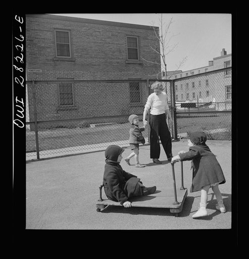 Buffalo, New York. Lakeview nursery school for children of working mothers, operated by the Board of Education at a tuition fee of three dollars weekly. Mother taking her child home after work