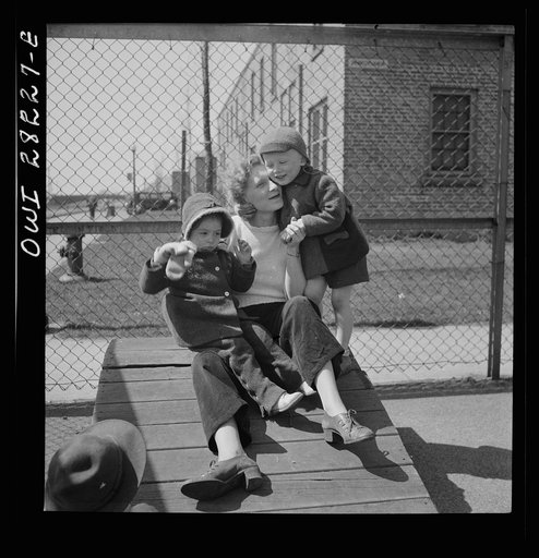 Buffalo, New York. Lakeview nursery school for children of working mothers, operated by the Board of Education at a tuition fee of three dollars weekly. Mother, who has come to pick up her child after work plays with other children