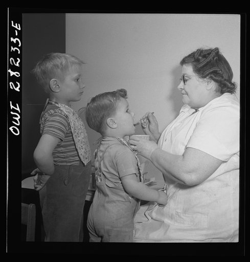 Buffalo, New York. Lakeview nursery school for children of working mothers, operated by the Board of Education oat a tuition fee of three dollars weekly. Taking cod liver oil after lunch