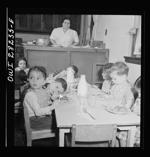 Untitled photo, possibly related to: Buffalo, New York. Lakeview nursery school for children of working mothers, operated by the Board of Education at a tuition fee of three dollars weekly. Eating lunch consists of meat and vegetables, milk, prune whip