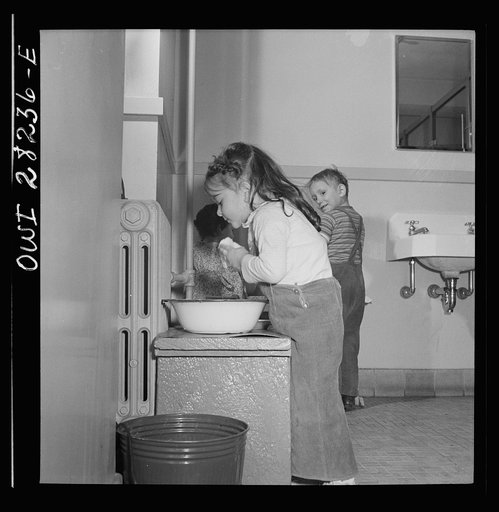 Buffalo, New York. Lakeview nursery school for children of working mothers, operated by the Board of Education at a tuition fee of three dollars weekly. Children washing themselves and combing their hair