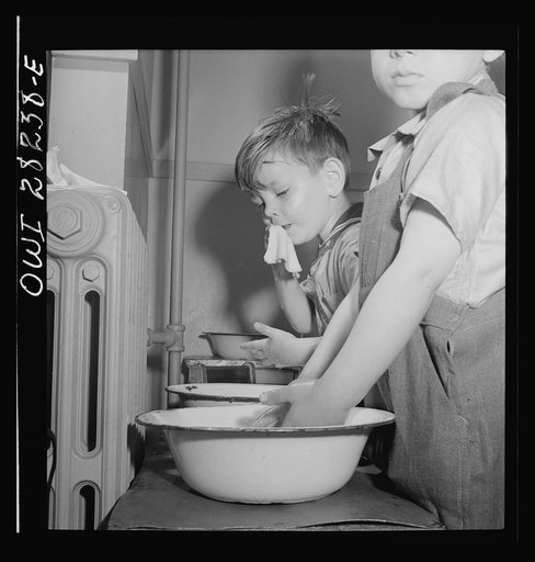 Untitled photo, possibly related to: Buffalo, New York. Lakeview nursery school for children of working mothers, operated by the Board of Education at a tuition fee of three dollars weekly. Children themselves washing and combing their hair
