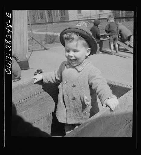 Buffalo, New York. Lakeview nursery school for children of working mothers, operated by the Board of Education at a tuition fee of three dollars weekly. Gary playing in the yard which is well-equipped