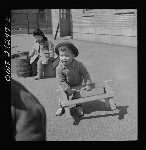 Buffalo, New York. Lakeview nursery school for children of working mothers, operated by the Board of Education at a tuition fee of three dollars weekly. Gary busy building contraptions in the well-equipped yard