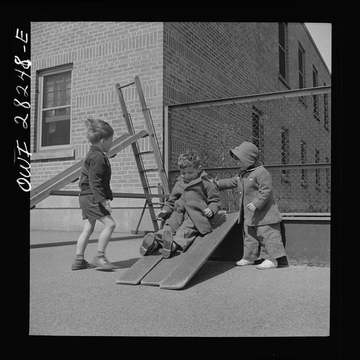 Buffalo, New York. Lakeview nursery school for children of working mothers, operated by the Board of Education at a tuition fee of three dollars weekly. Playing in the well-equipped yard