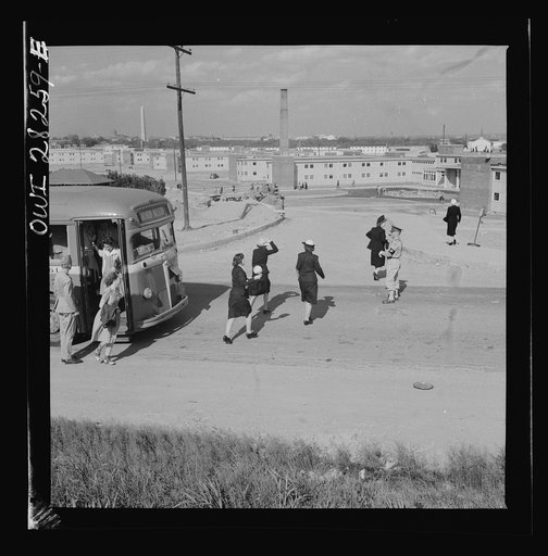 Arlington Farms, war duration residence halls. Crossing road in the front of Arlington Farms. A military police man acts as a traffic officer