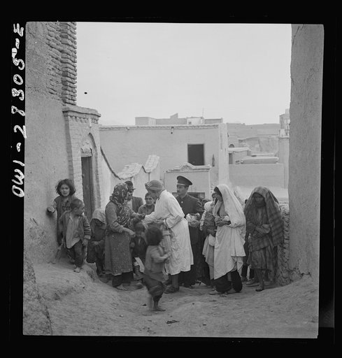 Teheran, Iran. Mrs. Louis Dreyfus, wife of the United States minister to Iran touring the poorer section of the city