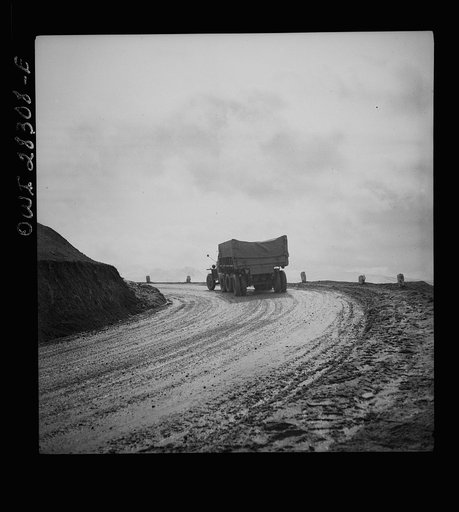 Somewhere in the Persian corridor. A United States Army truck convoy carrying supplies for the aid of Russia. Truck is shown rounding a turn as it heads for mountain top