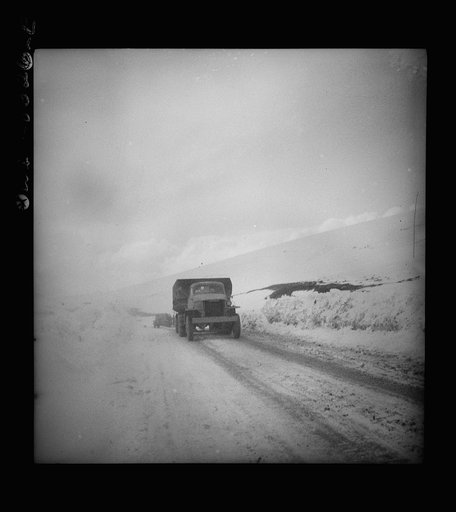 Somewhere in the Persian corridor. A United States Army truck convoy carrying supplies for the aid of Russia making a risky climb over a mountain pass