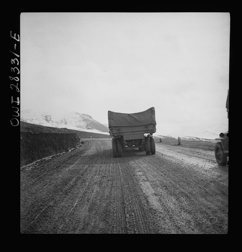 Somewhere in the Persian corridor. A United States Army truck convoy carrying supplies for the aid of Russia climbing a mountain road over the Iranian mountains