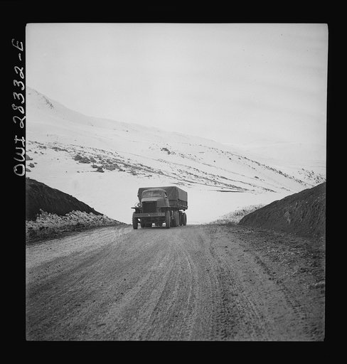 Somewhere in the Persian corridor. A United States Army truck convoy carrying supplies for the aid of Russia climbing a mountain road over the Iranian mountains