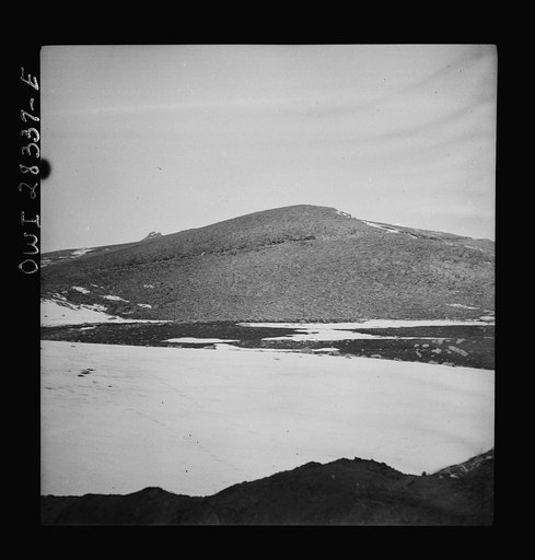 Somewhere in the Persian corridor. A United States Army truck convoy carrying supplies for the aid of Russia. Just below the top of the mountain climbing the steep grade