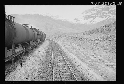 Tank cars carrying fuel, winding their way through some of the mountainous country somewhere in Iran