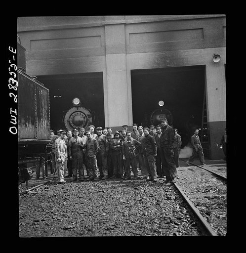 American and British railroad workers at a roundhouse somewhere in Iran