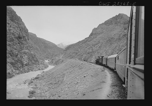 Mountainous route of trains carrying supplies to Russia. An American engine with an American crew along a gorge through the ever-winding route somewhere in Iran