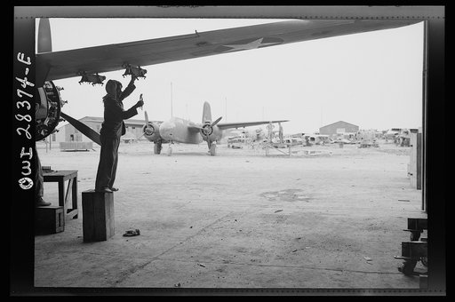 Iranian mechanic working on an American warplane about to be turned over to the Russians at a point of delivery somewhere in Iran