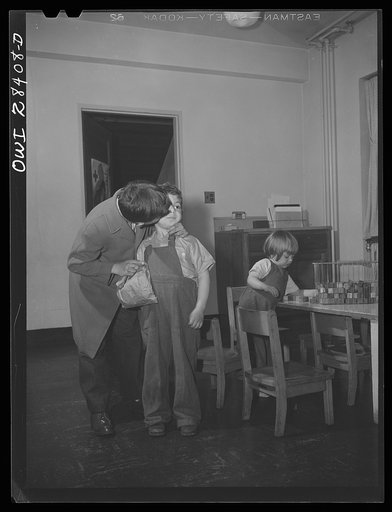 Buffalo, New York. Lakeview nursery school for children of working mothers, operated by the Board of Education at the tuition fee of three dollars weekly. An eleven year old boy brings his young sister and brother to school at 6:30 a.m. and stays with them until school opens. Their mother goes to wo
