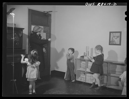 Buffalo, New York. Lakeview nursery school for children of working mothers, operated by the Board of Education at the tuition fee three dollars weekly. A mother saying goodbye to her child as she goes to work