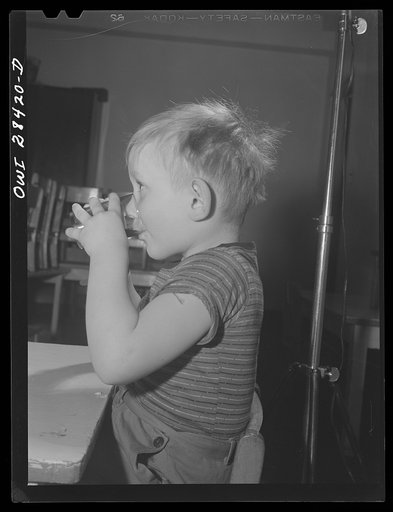 Buffalo, New York. Lakeview nursery school for children of working mothers, operated by the Board of Education at a tuition fee of three dollars weekly. Lee having breakfast