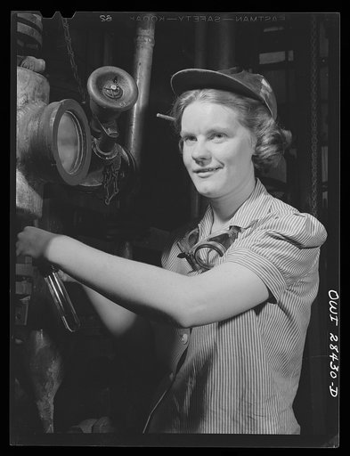 Niagara Falls, New York. Nan Hannegan a nineteen year old chemical operator at the Niacet chemical company, earning thirty-nine dollars a week, taking readings from dials and thermometers
