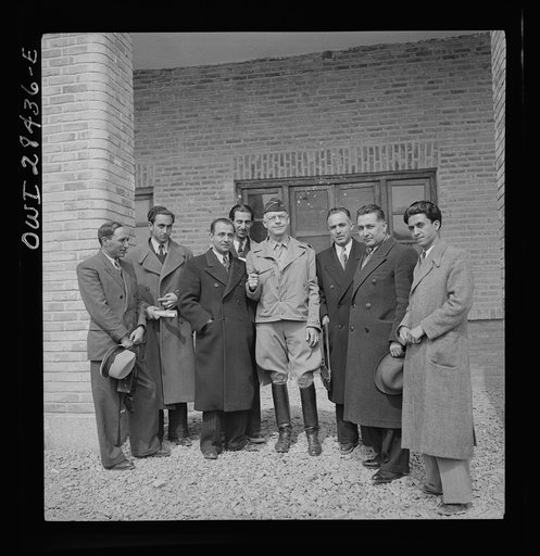 Major General Donald H. Connolly, the Commander of the United States Army Forces in Iran and Iraq, taking a group of Iranian journalists on a tour of United States Army installations. The journalists were guests at the soldiers' mess and were shown that only American food was served, thus not depriv