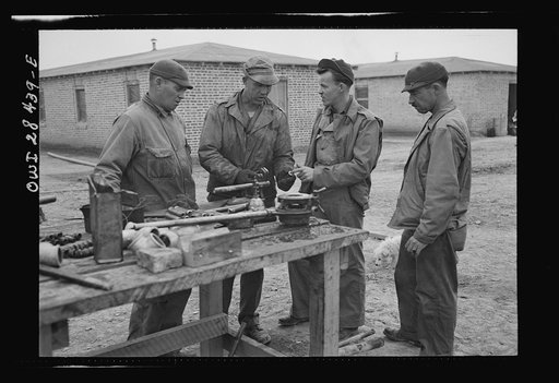 American troops working on their billets somewhere in Iran. Left to right: Private Irvin George Wood of Oil Field, Kansas; Private Paul Robinette of Youngstown, Ohio; Private Russell Luther of Clay City, Indiana; Private Edward McBride of Columbus, Ohio