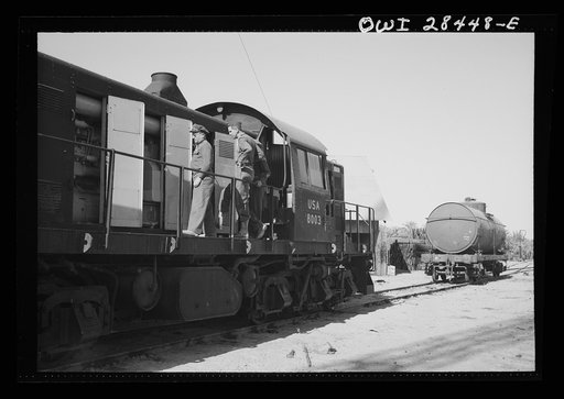 Major General Lewis Brererton, Commanding General of the United States Army Forces in the Middle East, inspecting a newly-arrived diesel railroad engine which is to be put into service to help speed the United States aid to Russia program