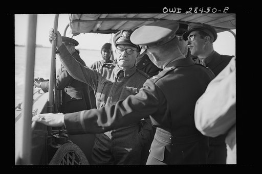 Major General Lewis Brererton inspecting port facilities somewhere in the Middle East. Handling ships bringing supplies for the aid of Russia