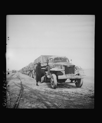 Somewhere in the Persian corridor. A United States Army truck convoy carrying supplies for Russia. Snow covered trucks start pushing through the mountain passes of Iran