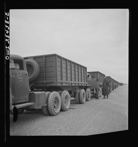 Somewhere in the Persian corridor. A United States Army truck convoy carrying supplies for the aid of Russia stopping for a rest