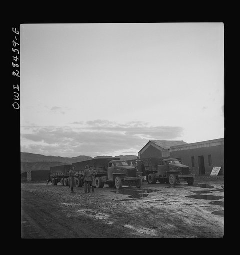 Somewhere in the Persian corridor. A United States Army truck convoy carrying supplies for Russia at a fueling point
