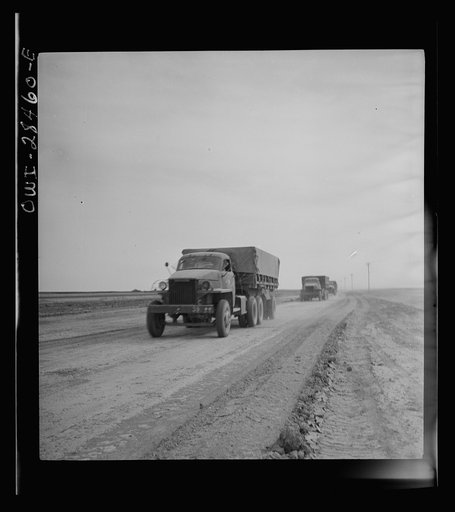 Somewhere in the Persian corridor. A United States Army truck convoy carrying supplies for Russia on a desert road. This is the beginning of a tough trip