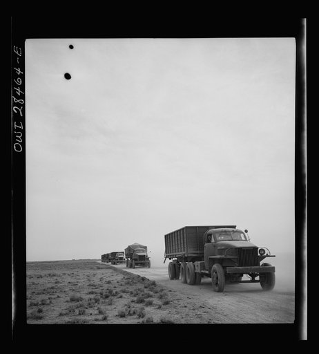 Somewhere in the Persian corridor. A United States Army truck convoy carrying supplies for Russia on a desert road