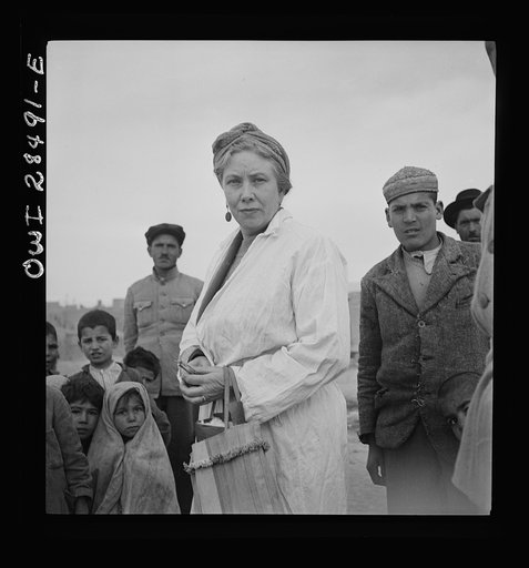 Teheran, Iran. Mrs. Louis Dreyfus, wife of the United States Minister to Iran, visiting a poor section of the city