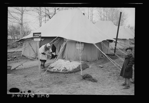 Teheran, Iran. Polish woman decorating her front yard with design of Polish eagle at an evacuation camp operated by the Red Cross