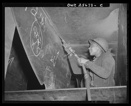 Kaiser shipyards, Richmond, California. Miss Eastine Cowner, a former waitress, is helping in her job as a scaler to construct the Liberty ship SS George Washington Carver