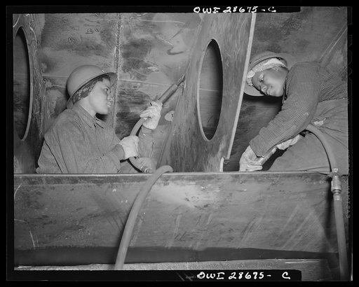 Bethlehem-Fairfield shipyards, Baltimore, Maryland. Negro women working as chippers, removing beads after a joint has been welded